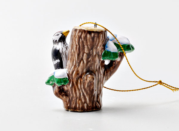 Christmas tree toy Woodpecker on a log