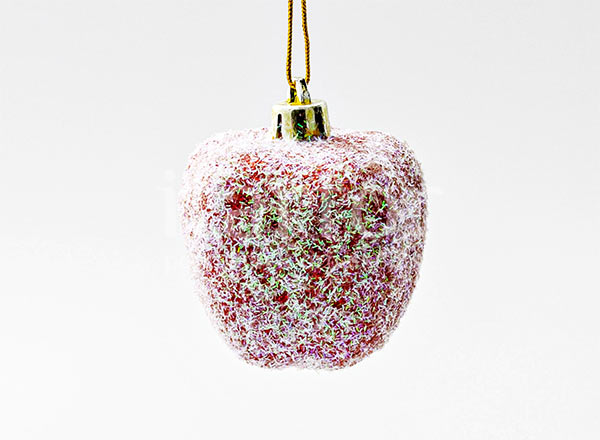 Christmas tree toy Berries and fruits. Red apple in ice