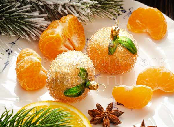 Christmas tree toy Berries and fruits. Mandarin in the dew
