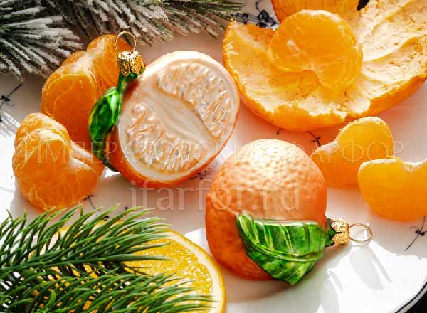 Christmas tree toy Berries and fruits. Half mandarin