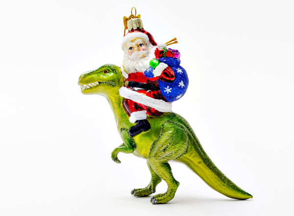 Christmas tree toy Santa Claus on a dinosaur