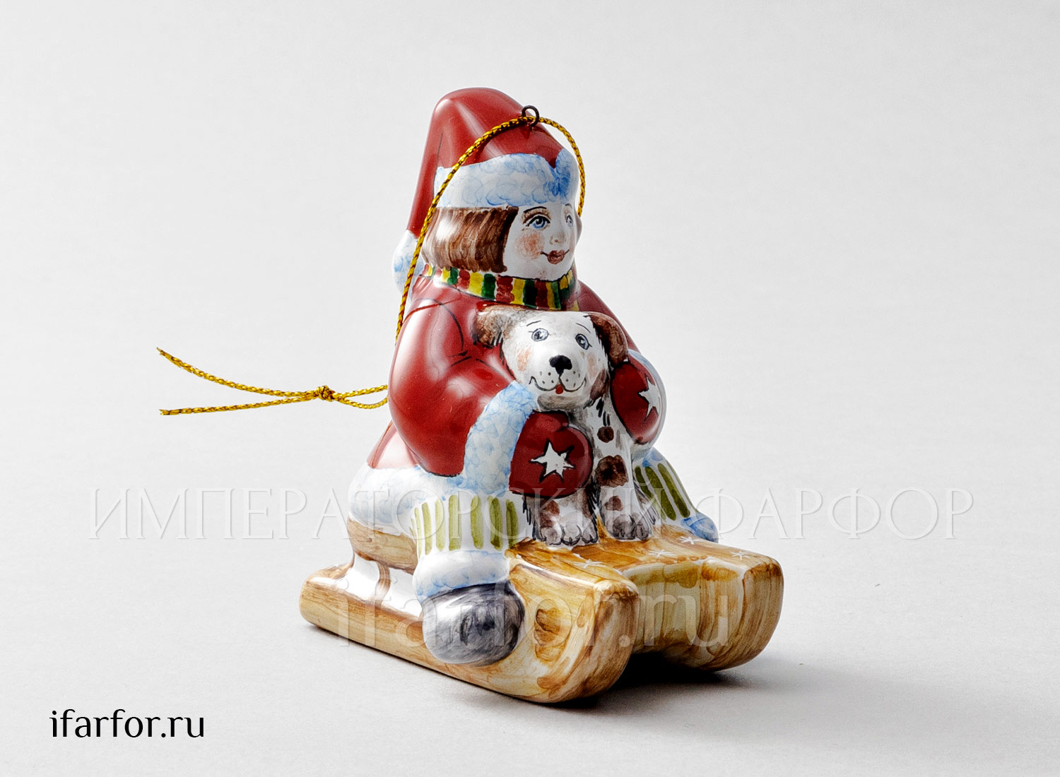 Елочная игрушка «Мальчик на санках с собачкой» Форма: Мальчик на санках с собачкой. Майолика. 60 x 85 x 93 мм.