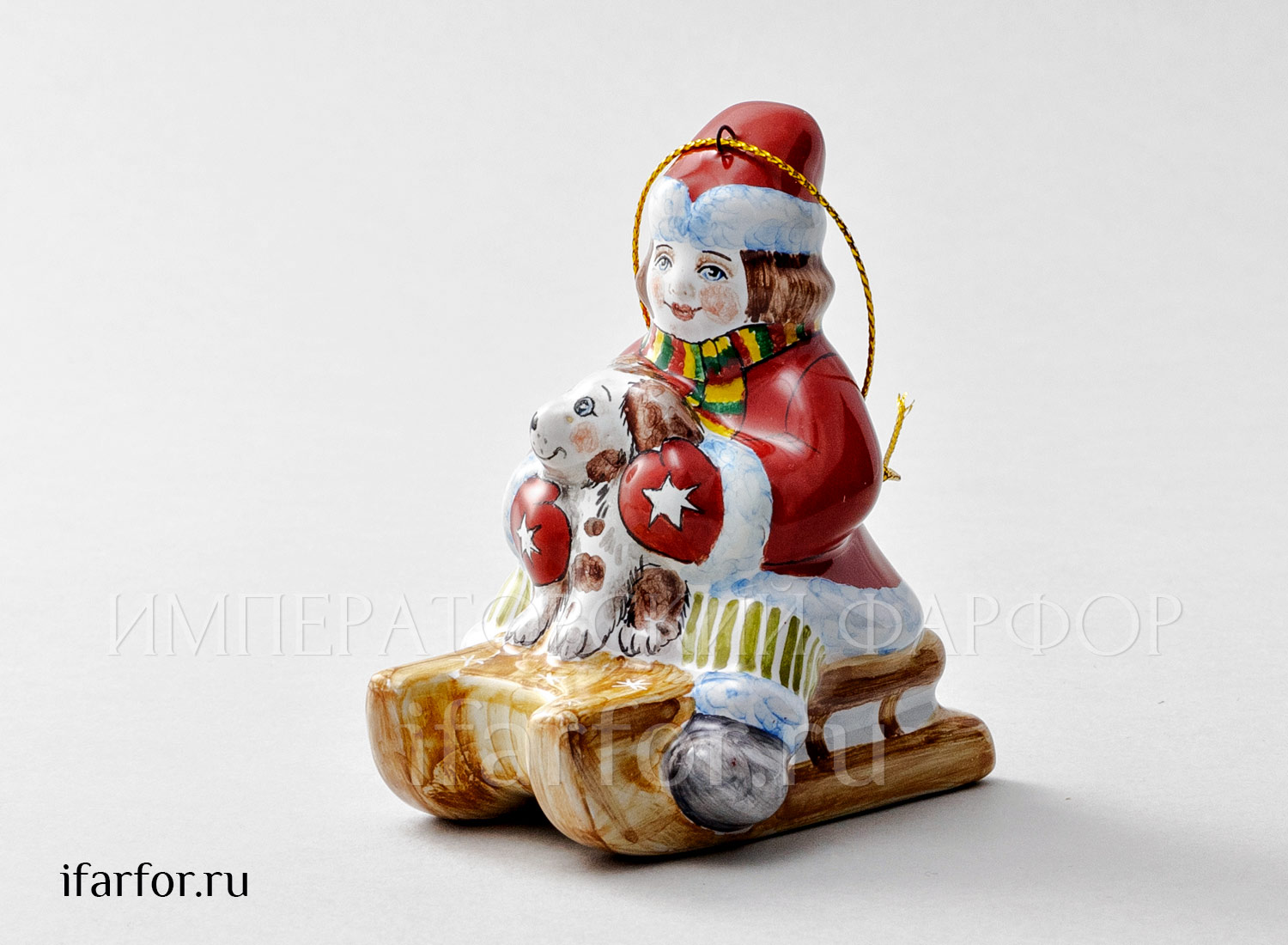 Елочная игрушка «Мальчик на санках с собачкой» Форма: Мальчик на санках с собачкой. Майолика. 60 x 85 x 93 мм.