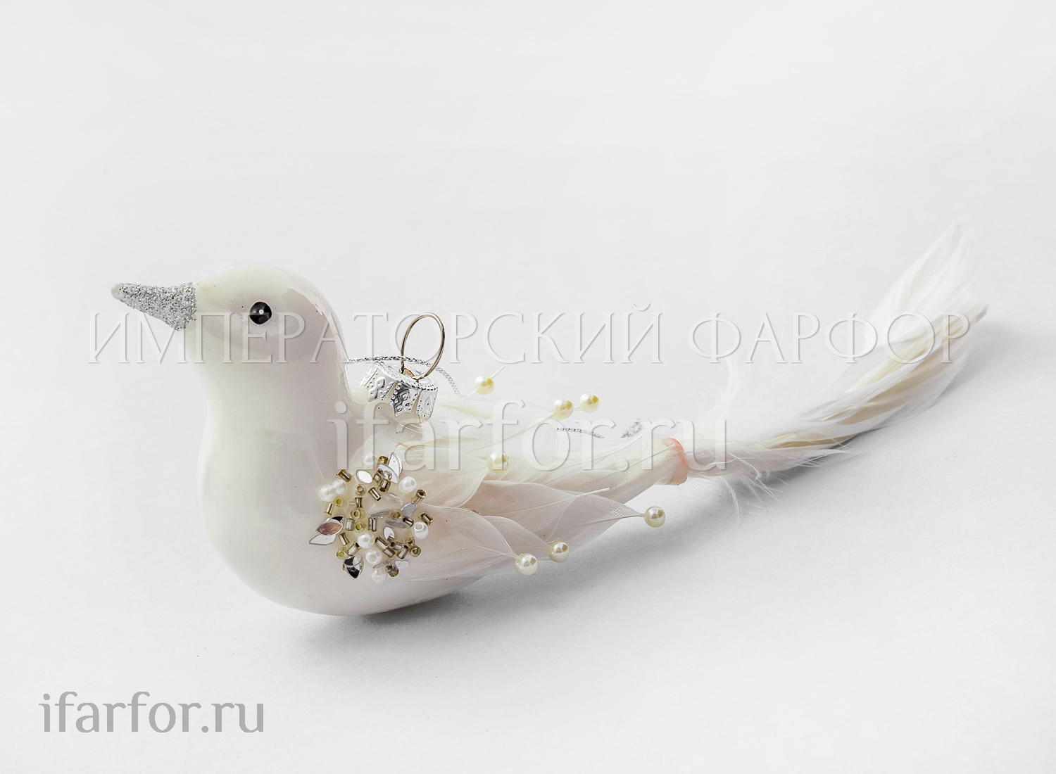 Елочная игрушка «Жемчужная птица» Форма: Жемчужная птица. Стекло, перо, ПВХ. 200 x 70 мм.