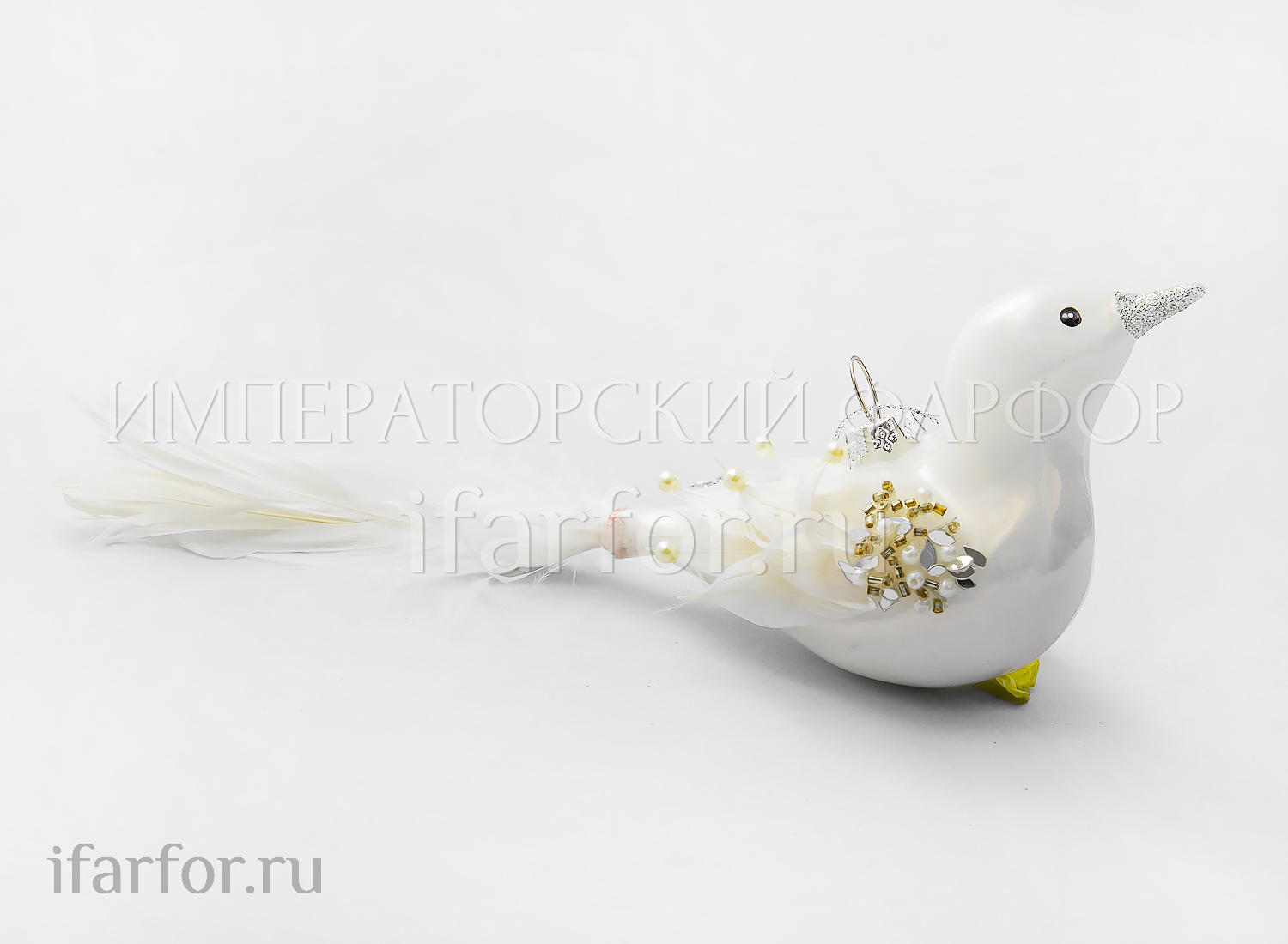 Елочная игрушка «Жемчужная птица» Форма: Жемчужная птица. Стекло, перо, ПВХ. 200 x 70 мм.