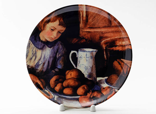 Decorative plate Serebriakova Zinaida Katya at the kitchen table